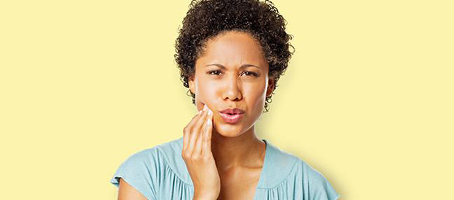 woman looking concerned about gum disease and gingivitis