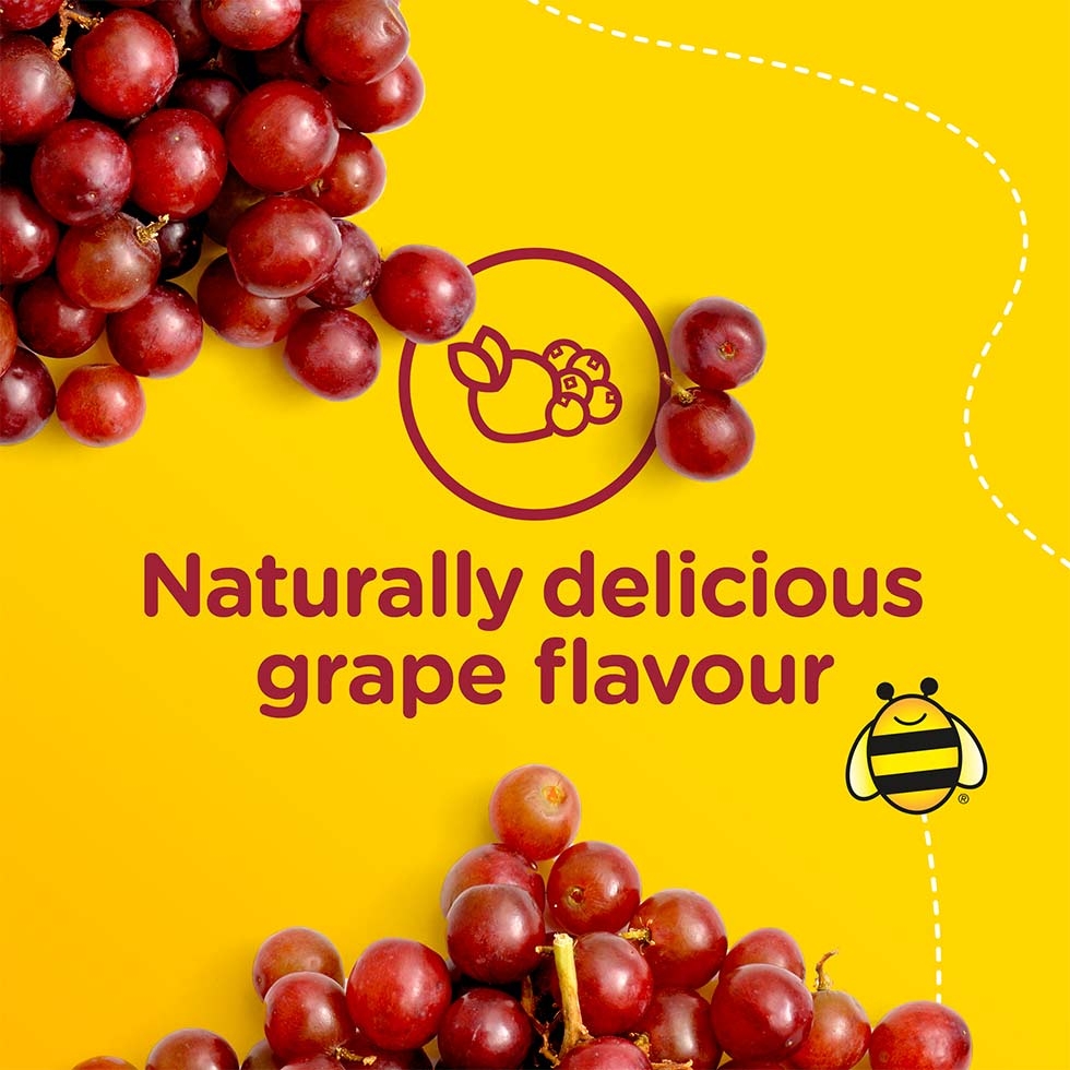 Grapes strewn across a yellow background with the text 'naturally delicious grape flavour'