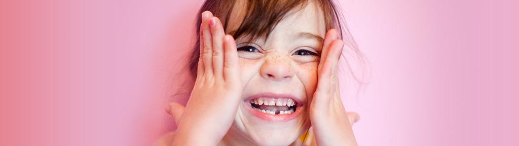 little girl smiling with a tooth gap | LISTERINE