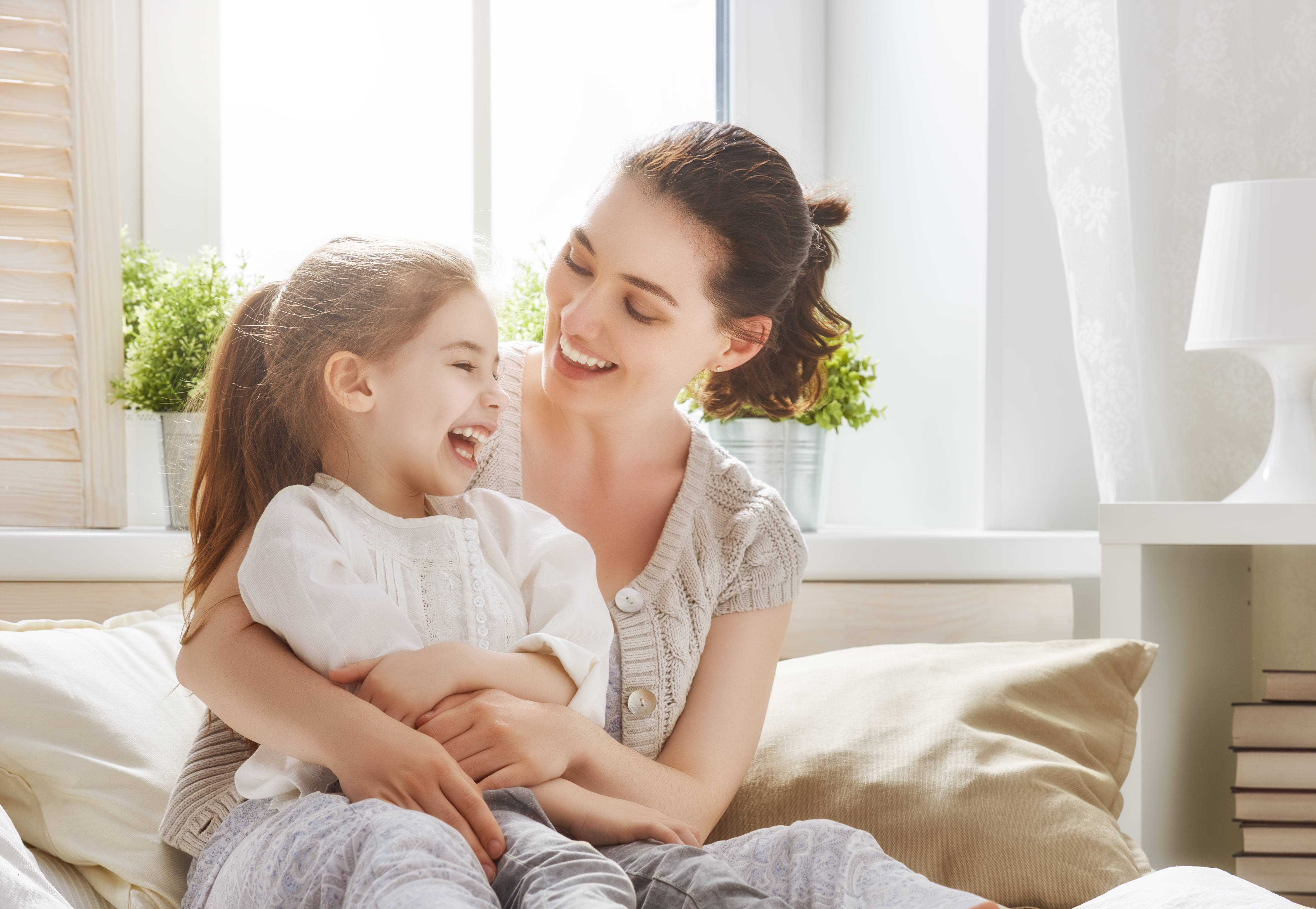 Joyful moment between a mother and her young daughter