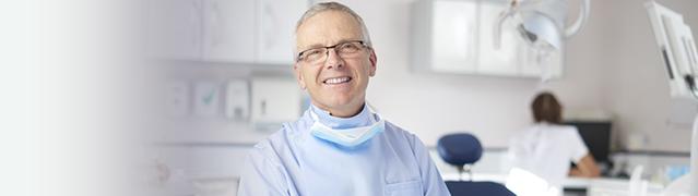 dentist smiling in a dental office