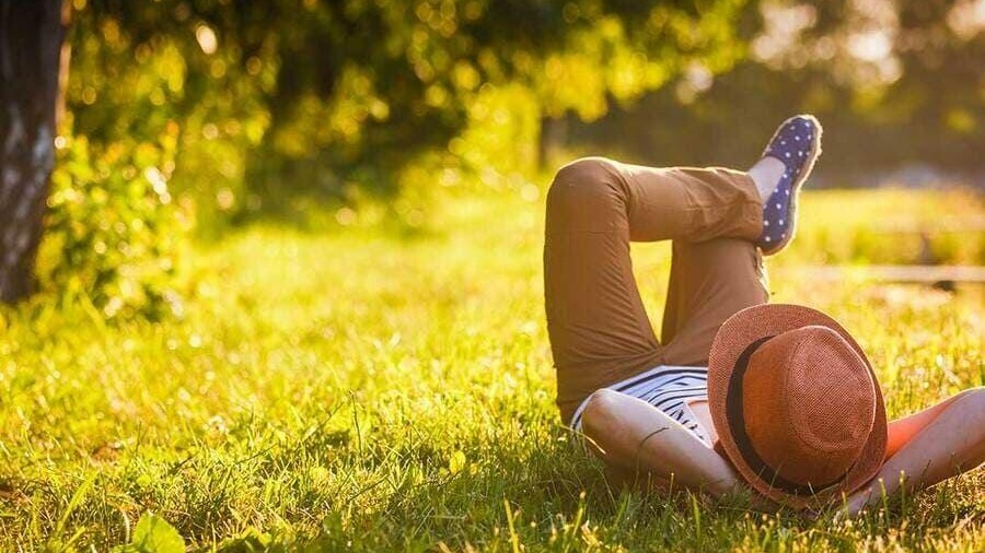 Person lying down on the grass