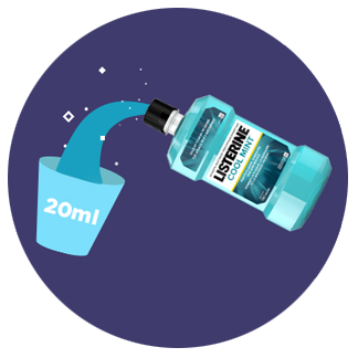 Pouring two tablespoons of Listerine Antiseptic mouthwash into a cup