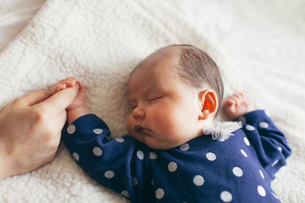 Baby sleeping on his back