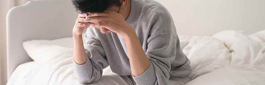 Man having a headache and holding his head