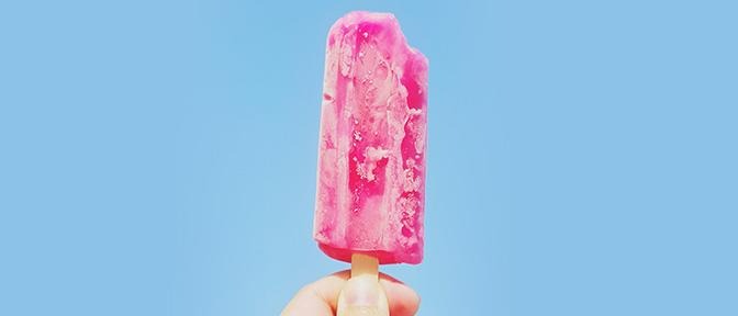 hand holding a sugary popsicle | LISTERINE