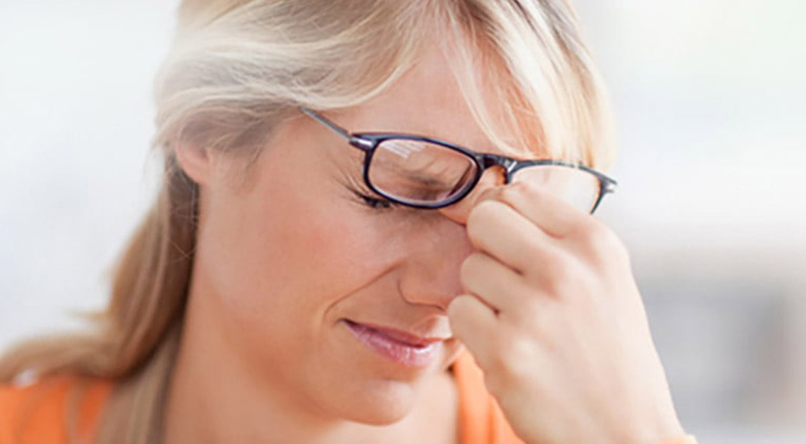 Woman suffering from a headache