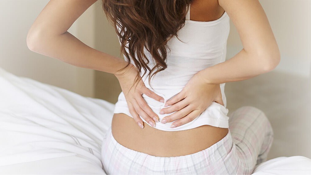 Lady suffering from back pain banner