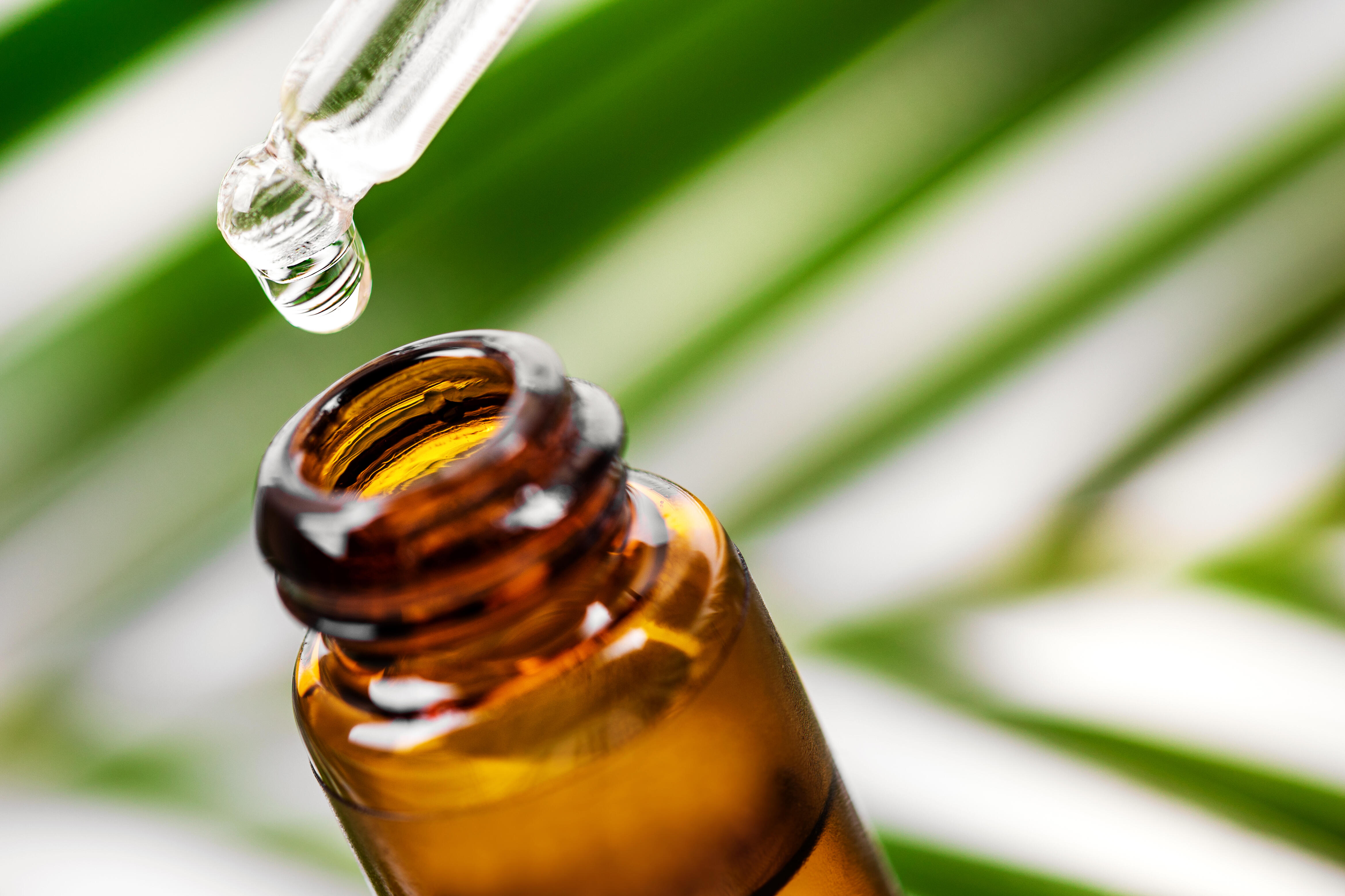 A banner displaying a bottle of essential oil