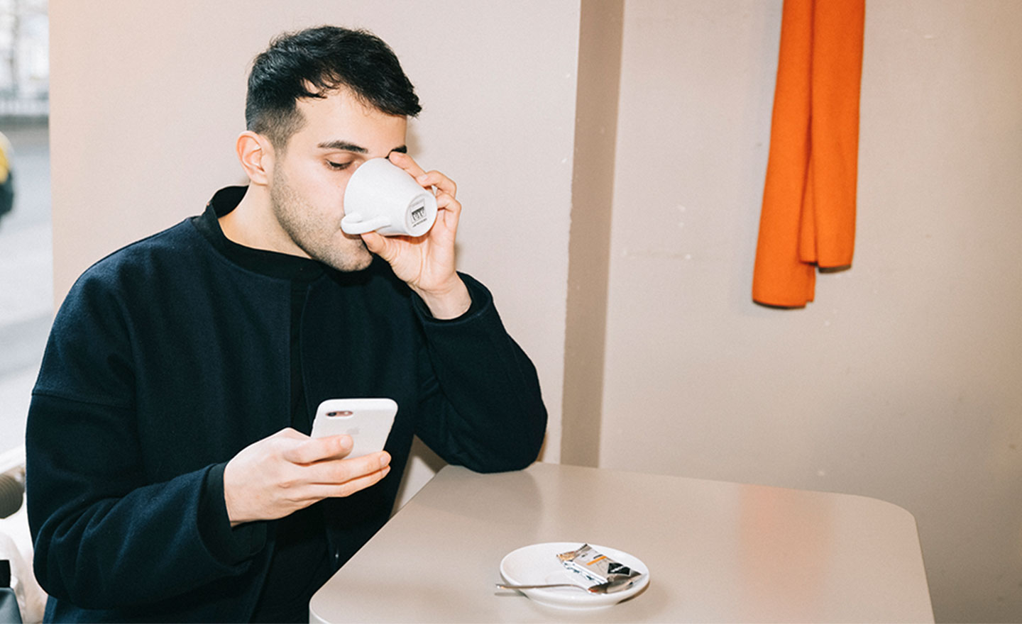 A person drinking coffee