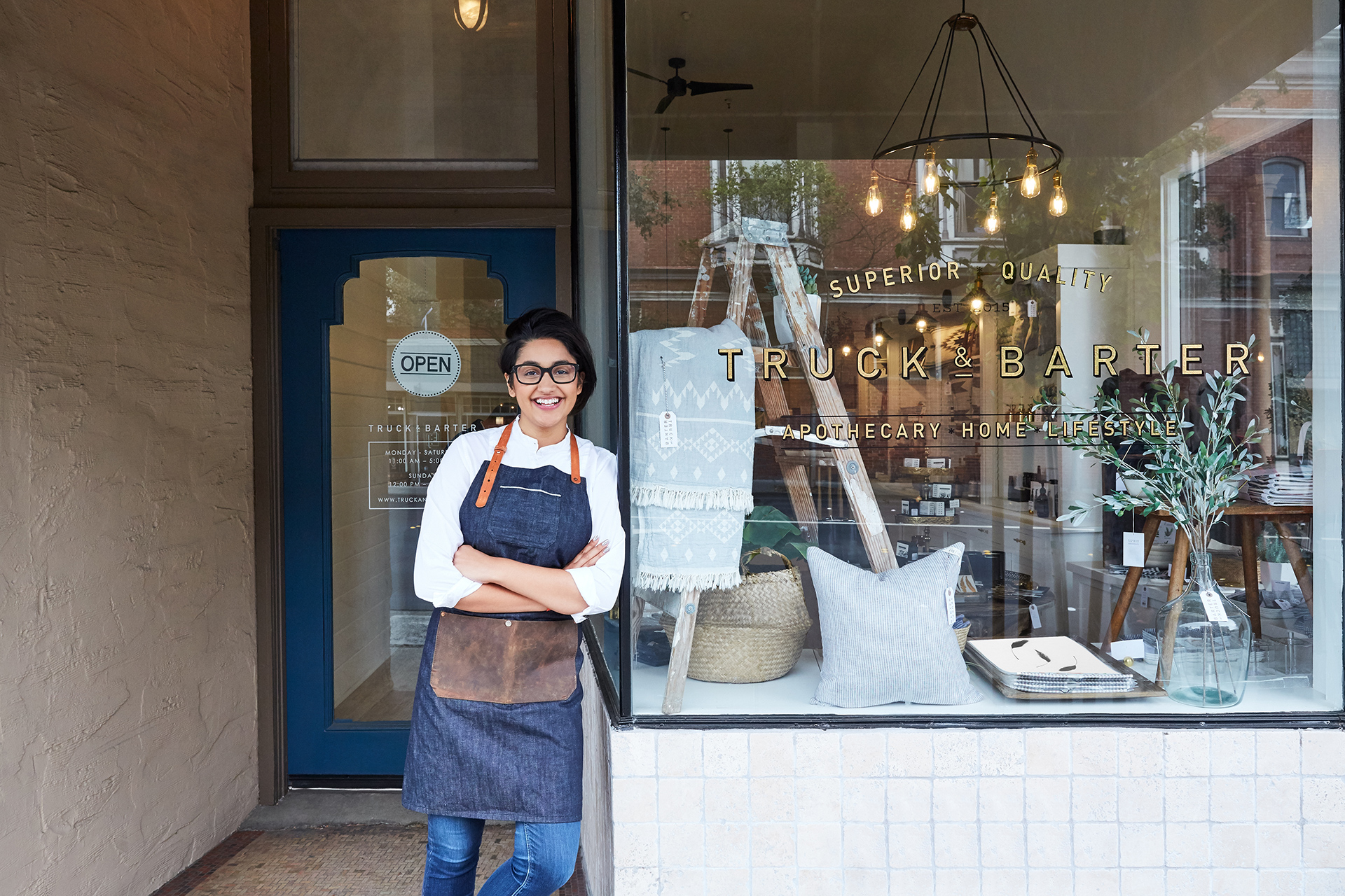 Merchant standing in front of store