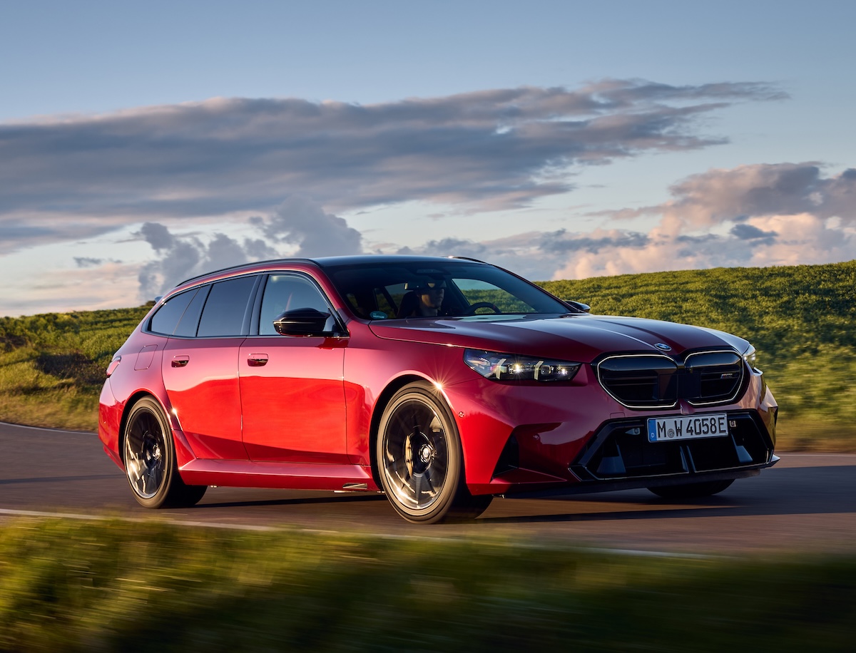 BMW M5 Touring 2025 red front driving