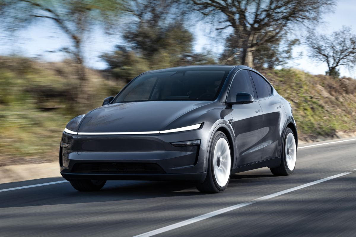 2025 Tesla Model Y grey front driving