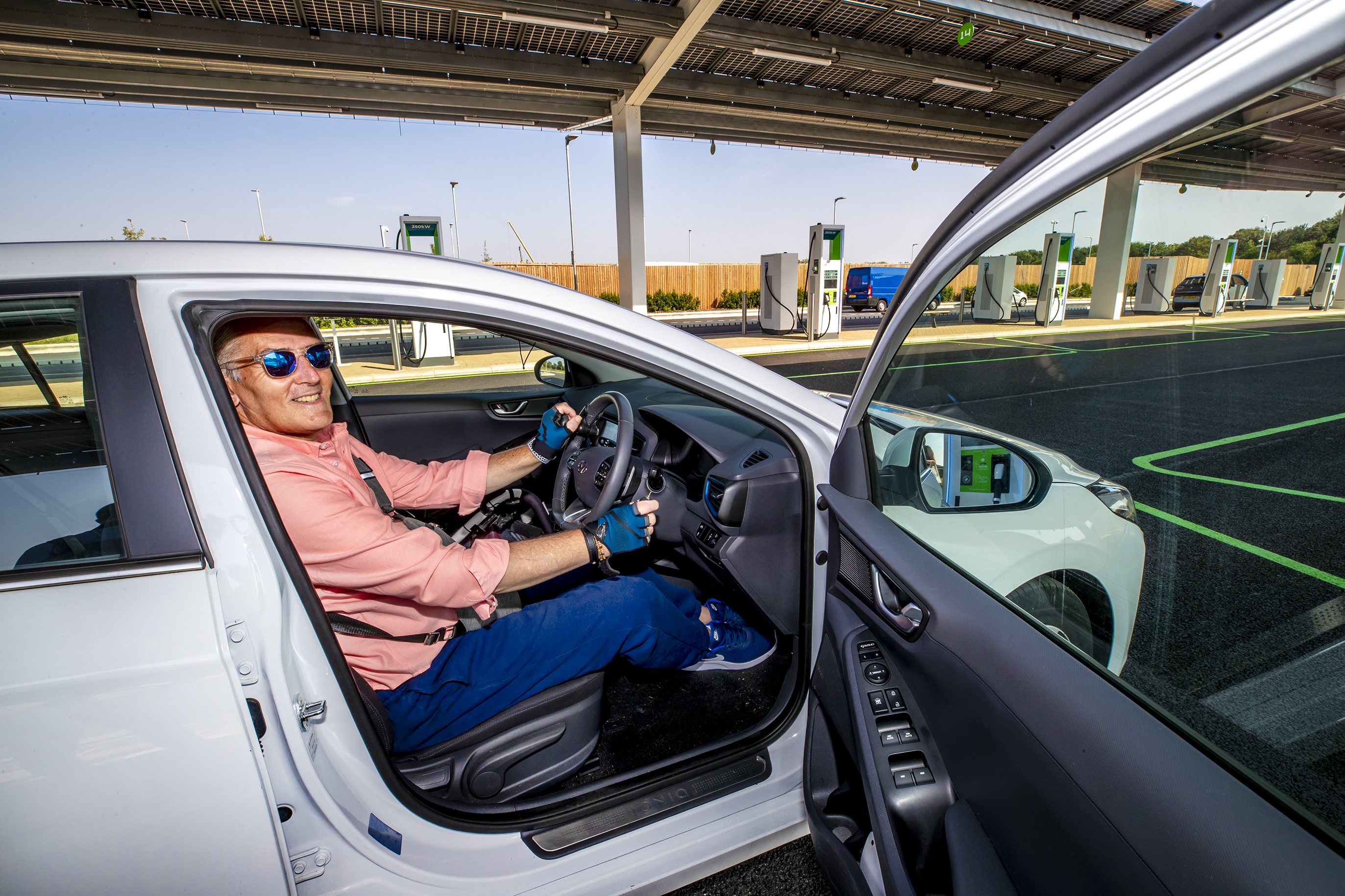 Disabled driver charging electric car 5