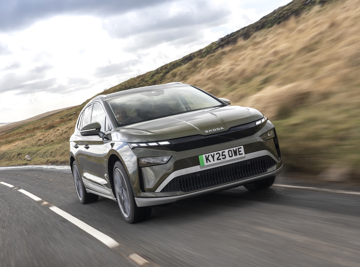 Skoda Enyaq front three-quarter view driving on a road.