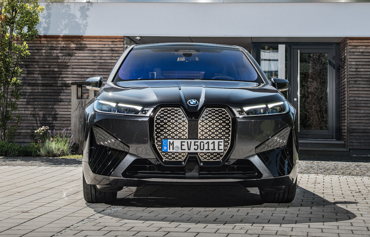 2022 BMW iX rear three quarters driving