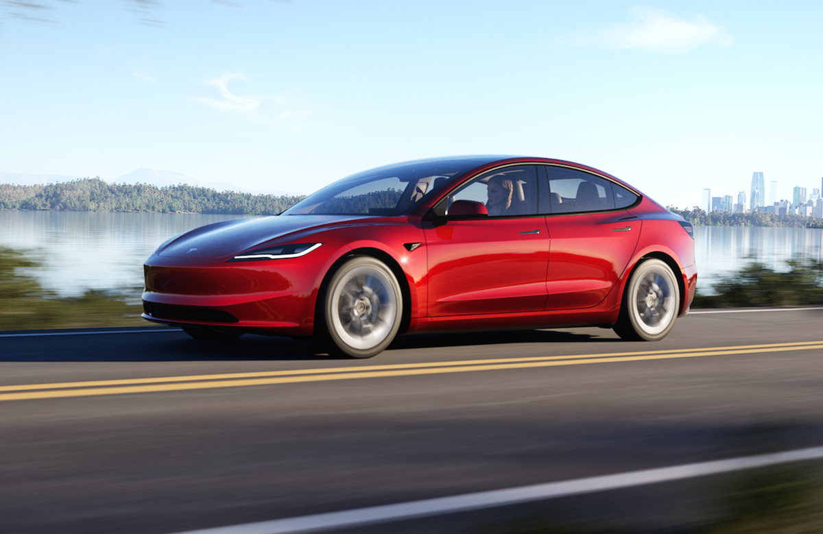 2024 Tesla Model 3 red front driving