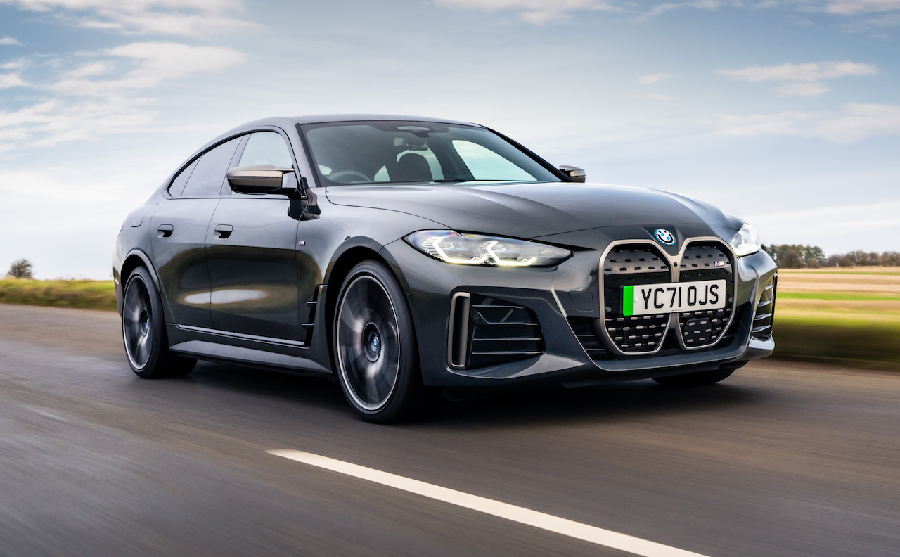 2021 BMW i4 rear three quarters driving