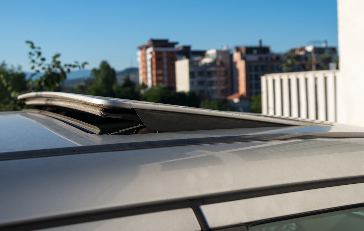 Manual sunroof silver car