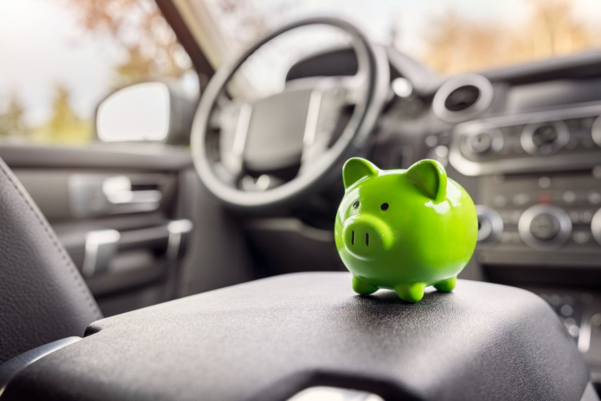 green-piggy-bank-money-box-inside-car