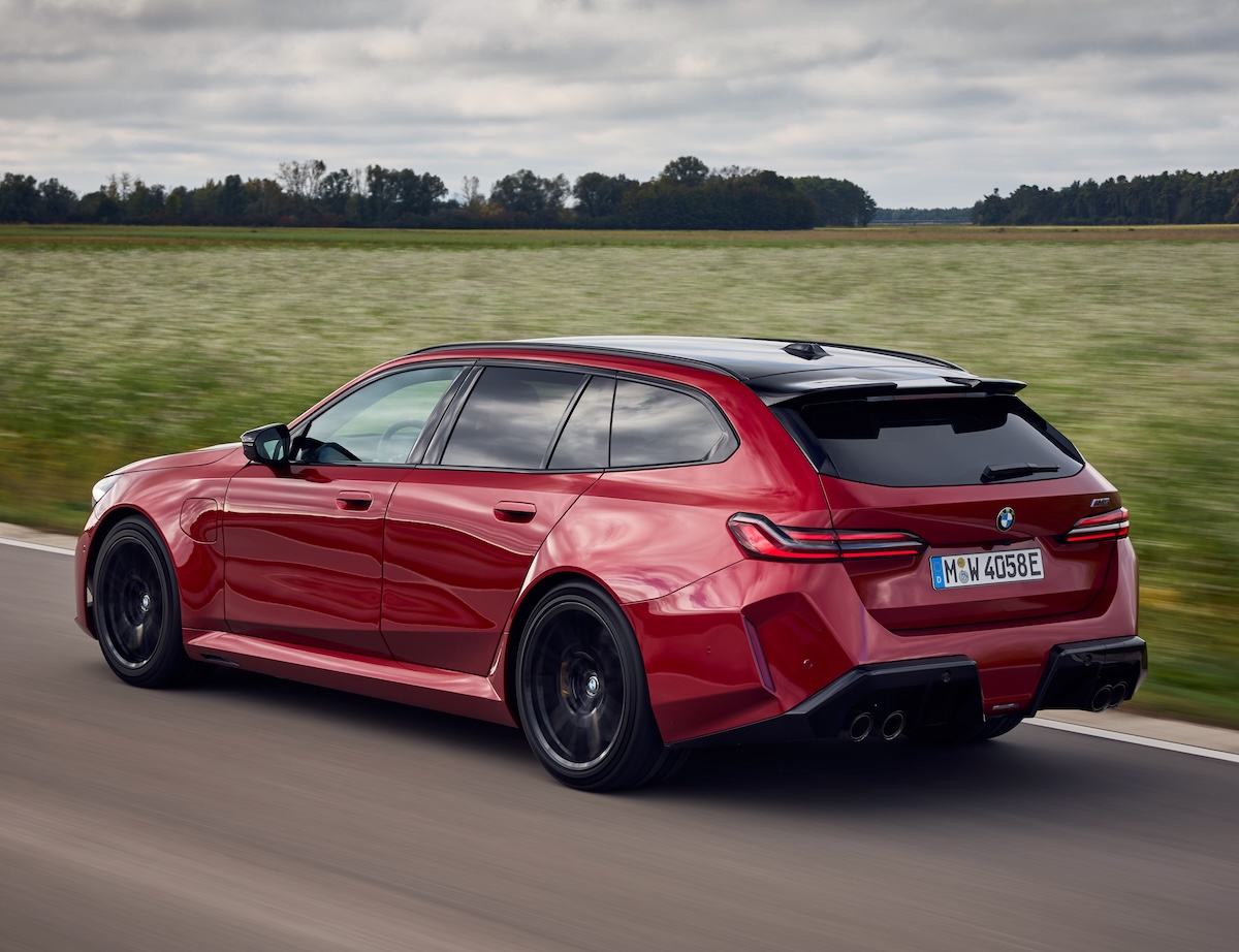 BMW M5 Touring 2025 red rear driving