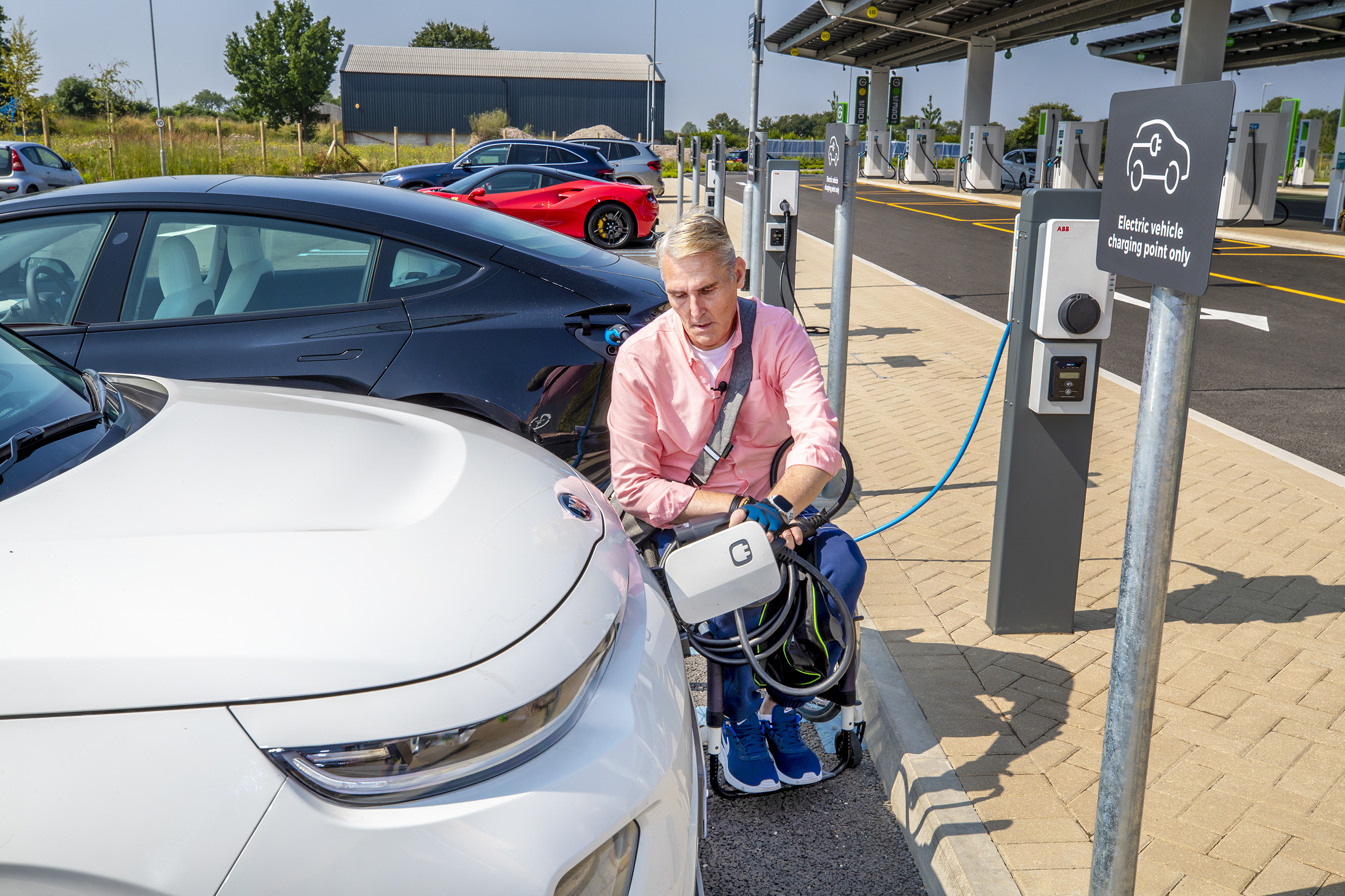 Disabled driver charging electric car 3