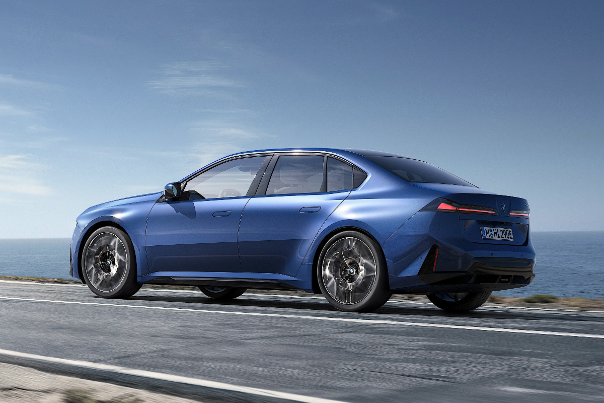 2026 BMW i3 driving rear 3 4