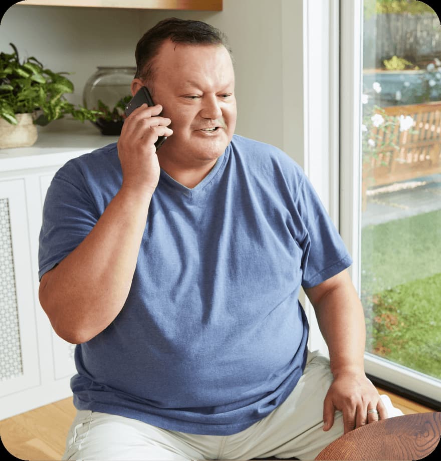 Person sitting while talking on the phone