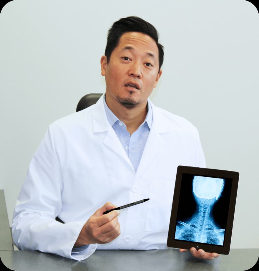 Doctor holding up an x-ray 
