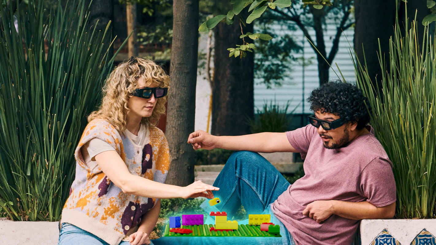 People sitting on bench wearing Spectacles.