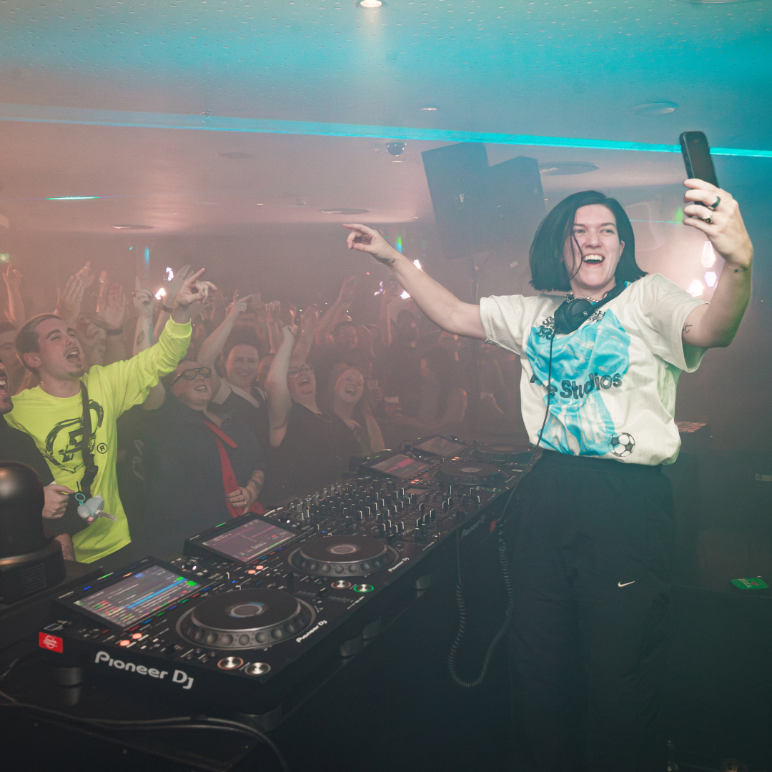 Romy performing in the Gravity Bar engaging with the crowd