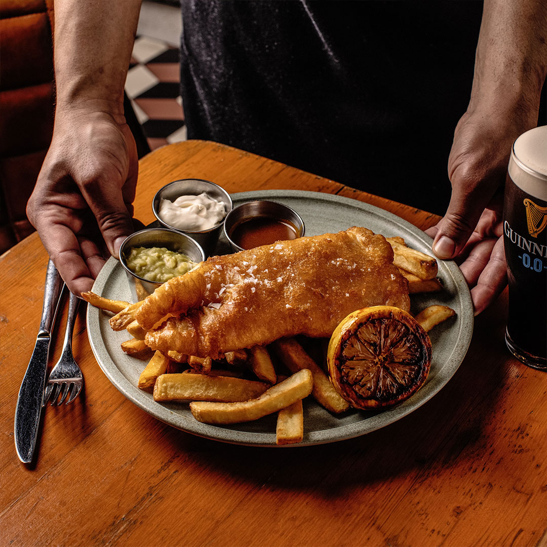 Fish and chips served with a Guinness 0.0 at the Guinness Storehouse