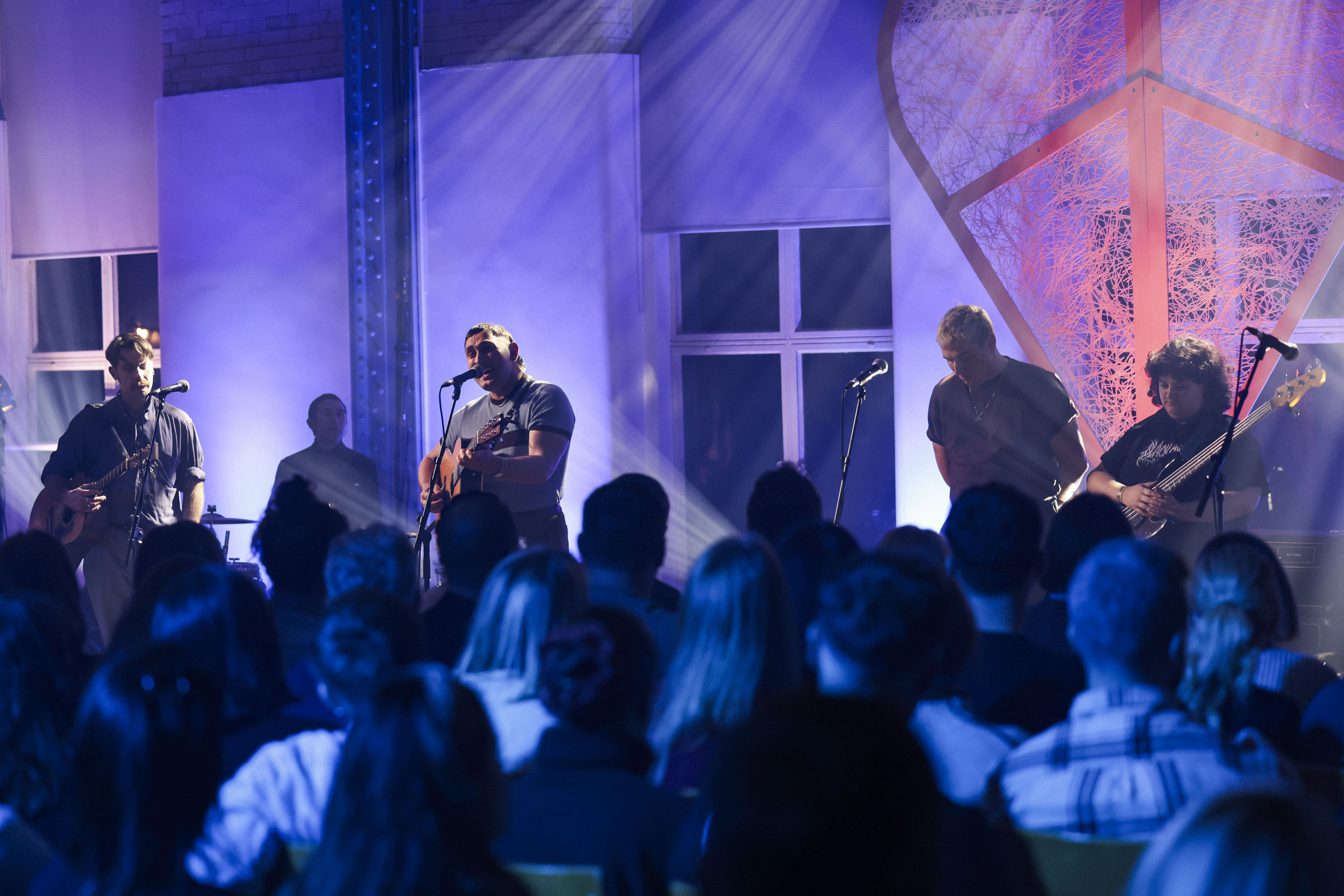 Glimpse of the artist performing on the stage along with the audience