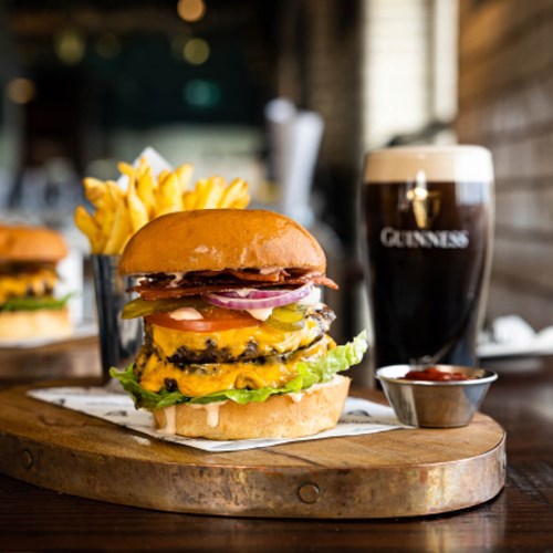Double Guinness Cheeseburger with crispy bacon, pickle, onion, lettuce, served on a brioche bun with house fries and ketchup dip.