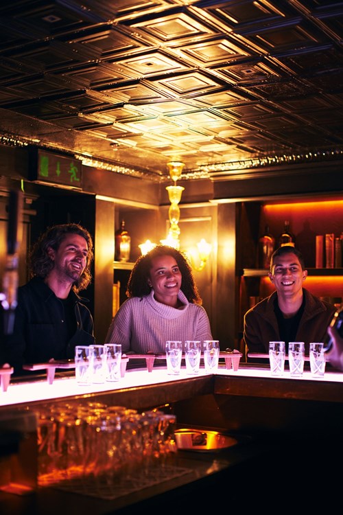 Happy visitors listening to the tour guide during her Connoisseur Experience