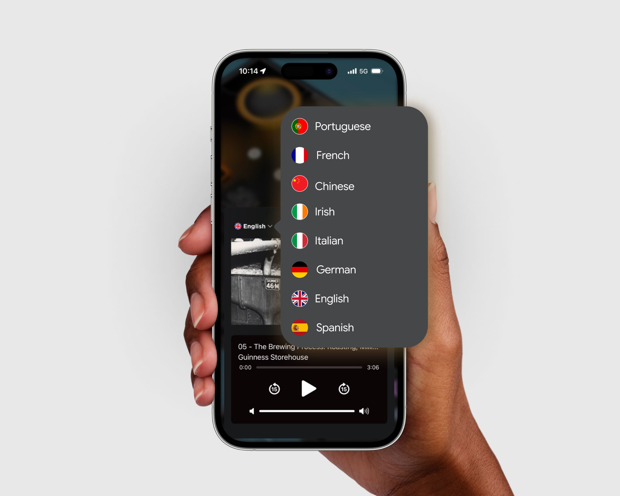 Person holding a smartphone displaying the Guinness Storehouse app while using Audio Guide