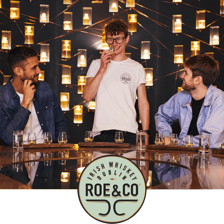 Two individuals intrigued by their whiskey blending experience in the fabulous Roe & Co Whiskey Distillery