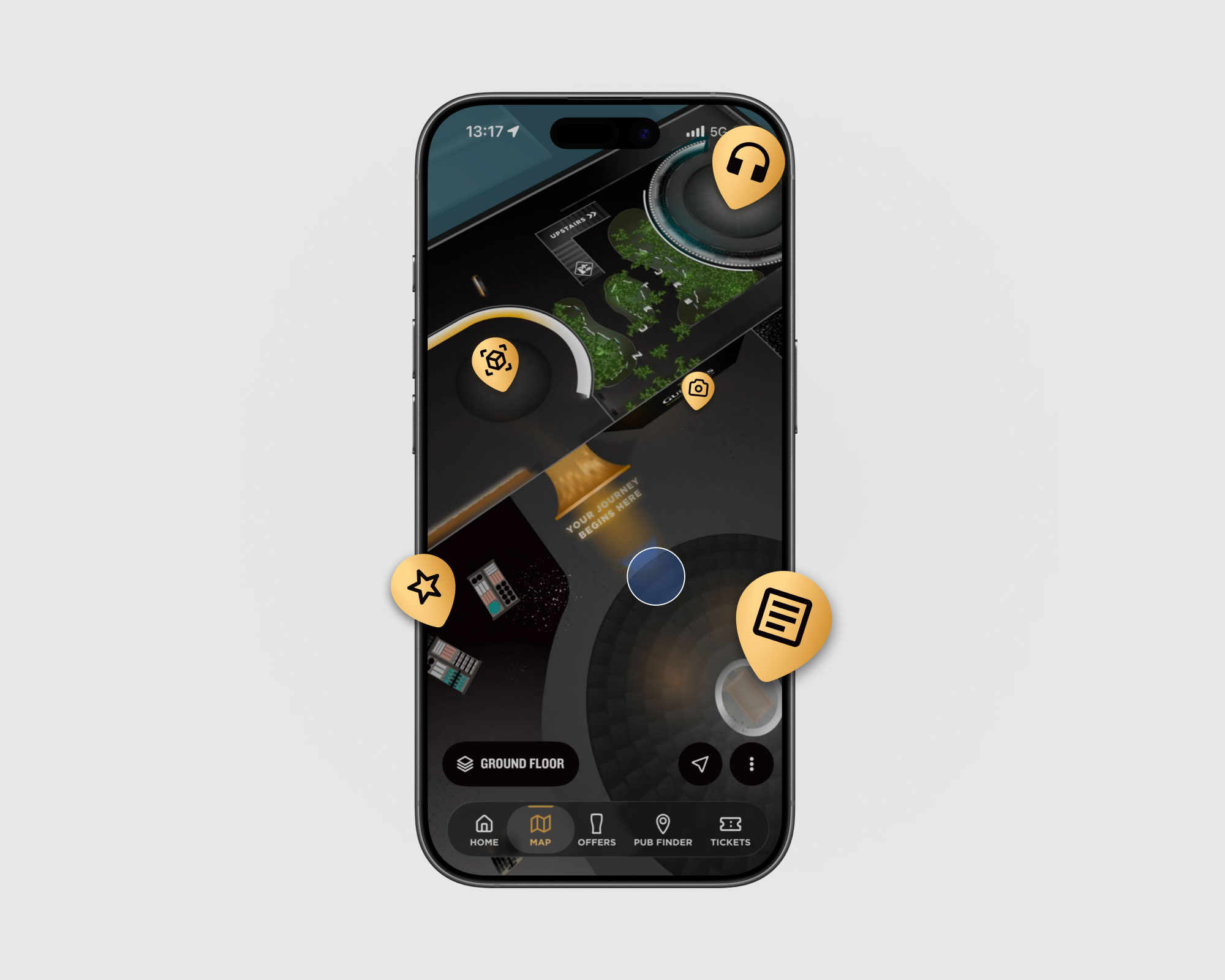 Person holding a smartphone displaying the Guinness Storehouse app while using find your way