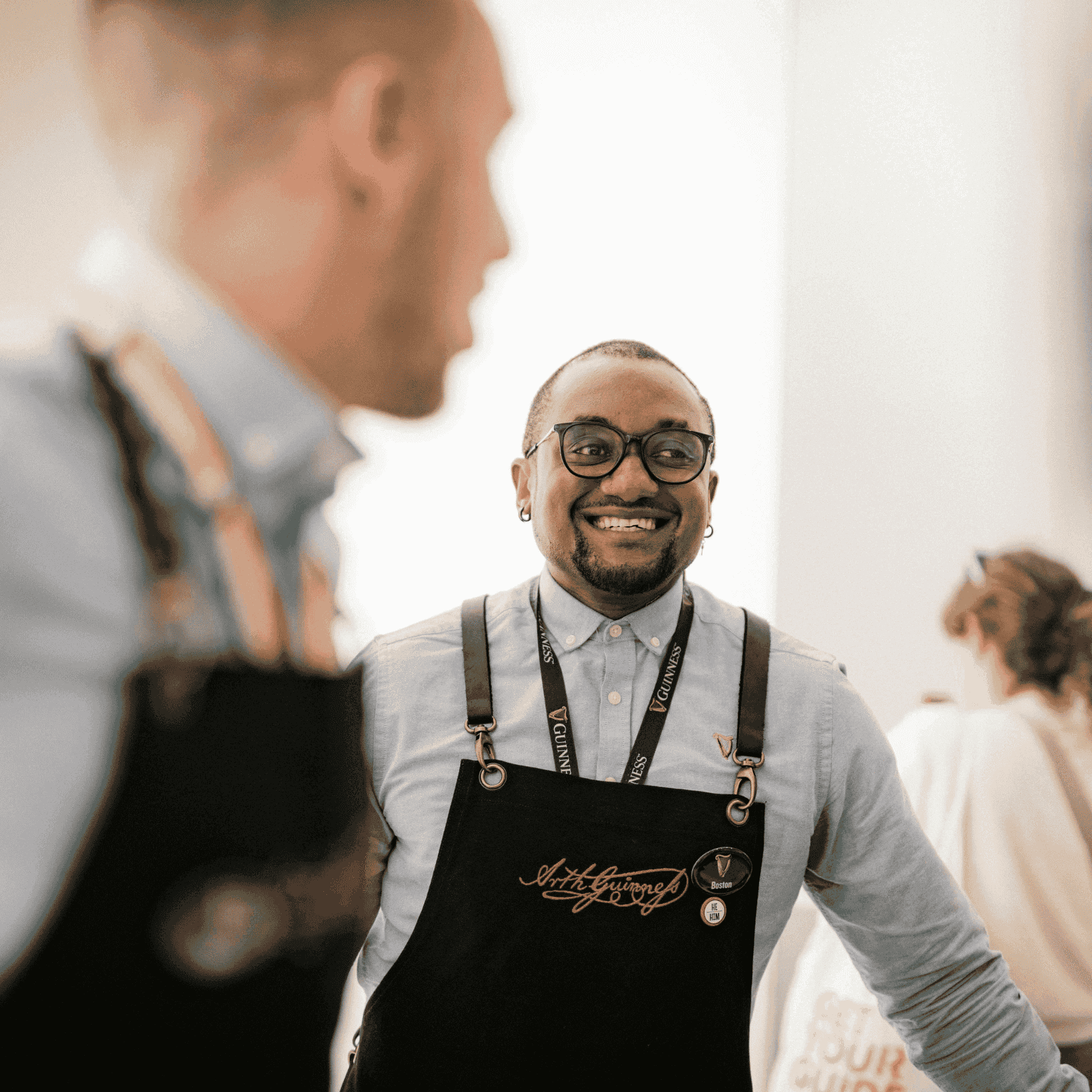 Two Guiness Storehouse employees talking in the building