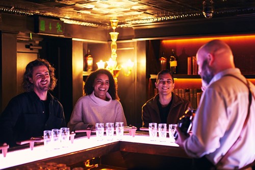 Happy visitors listening to the tour guide during her Connoisseur Experience