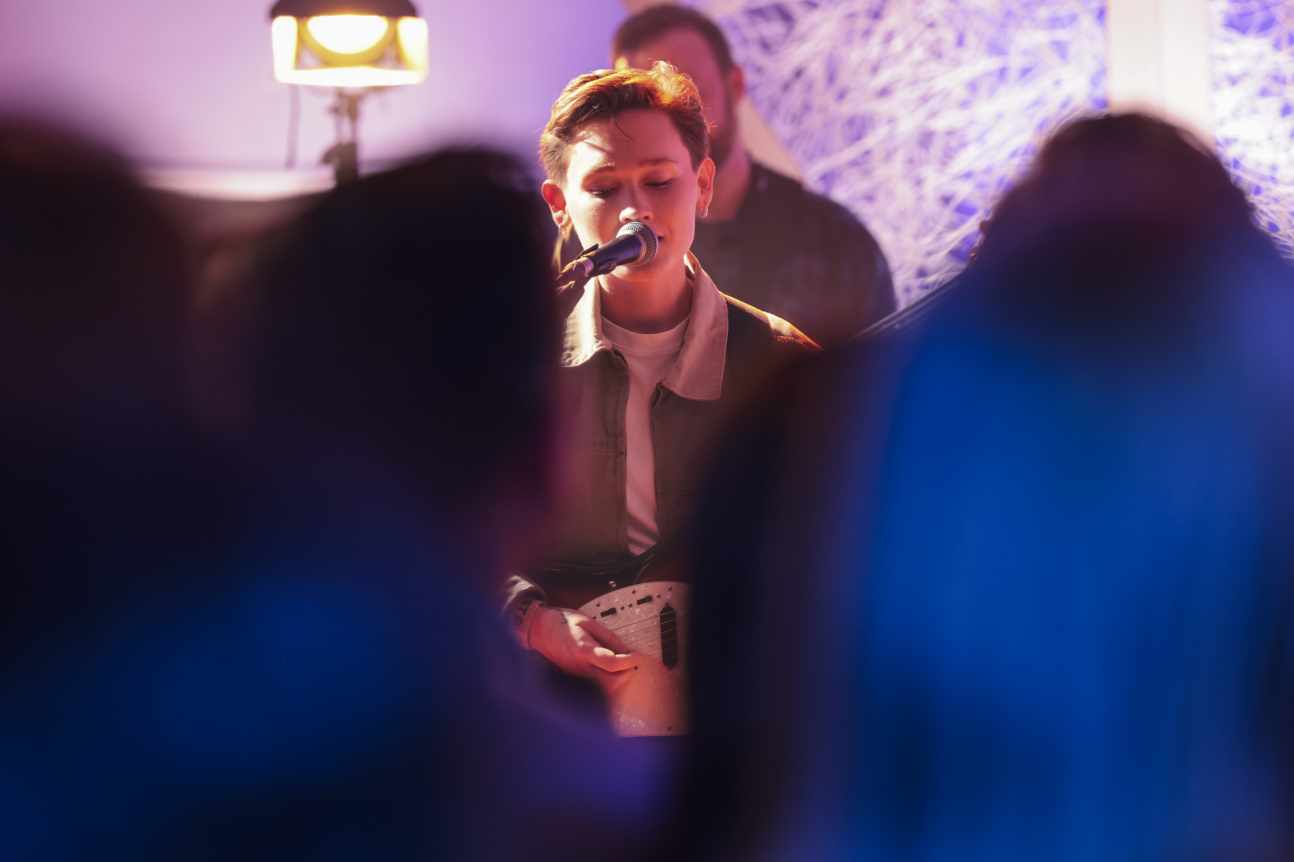 A close picture of a male singer at Other Voices 2024