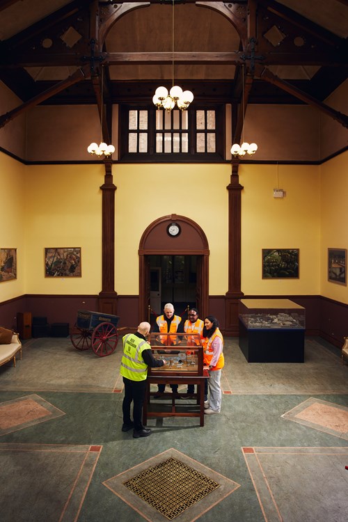 Visitors exploring the Cash Office.
