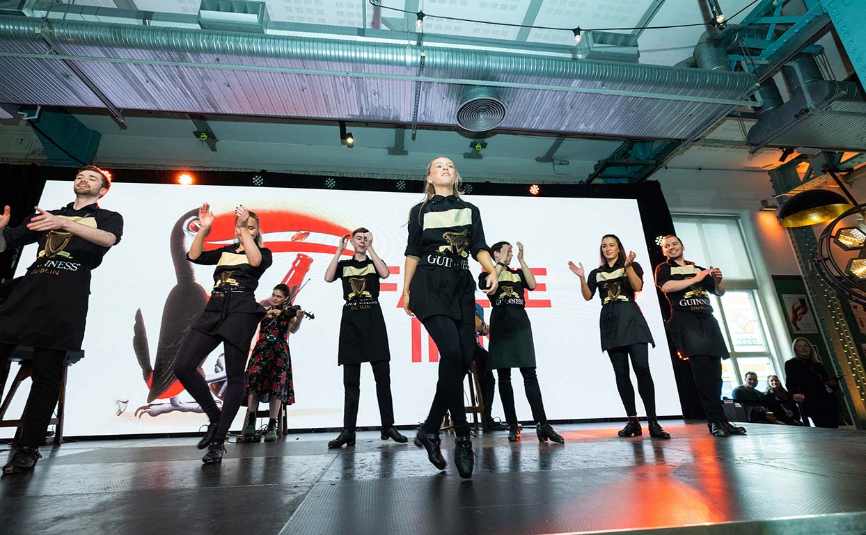 A group of Irish dancers on stage at Guinness Storehouse