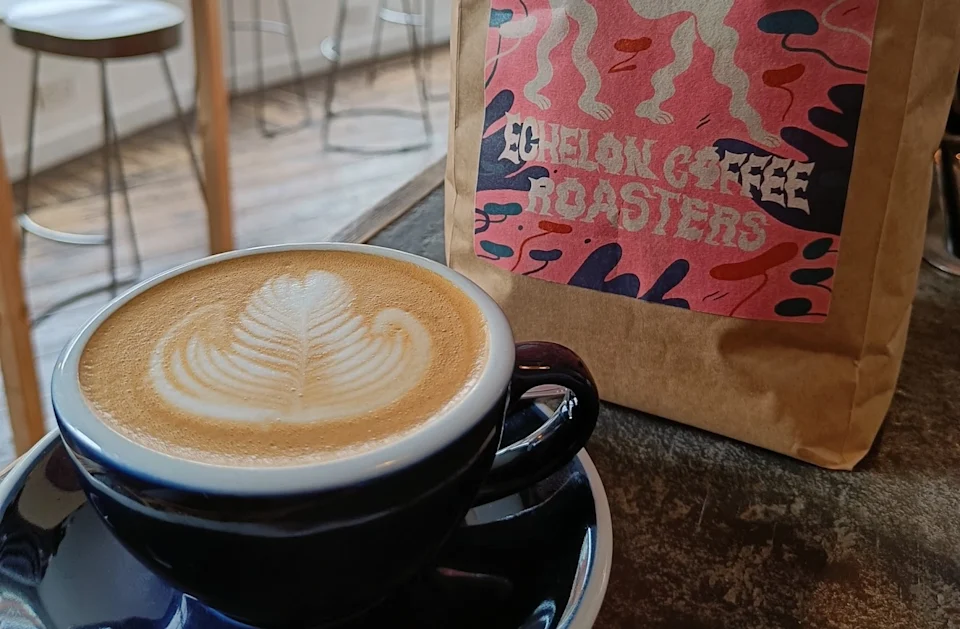 Latte art in a blue cup at Stage