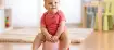 Potty Training Tips: toddler sitting happily on potty