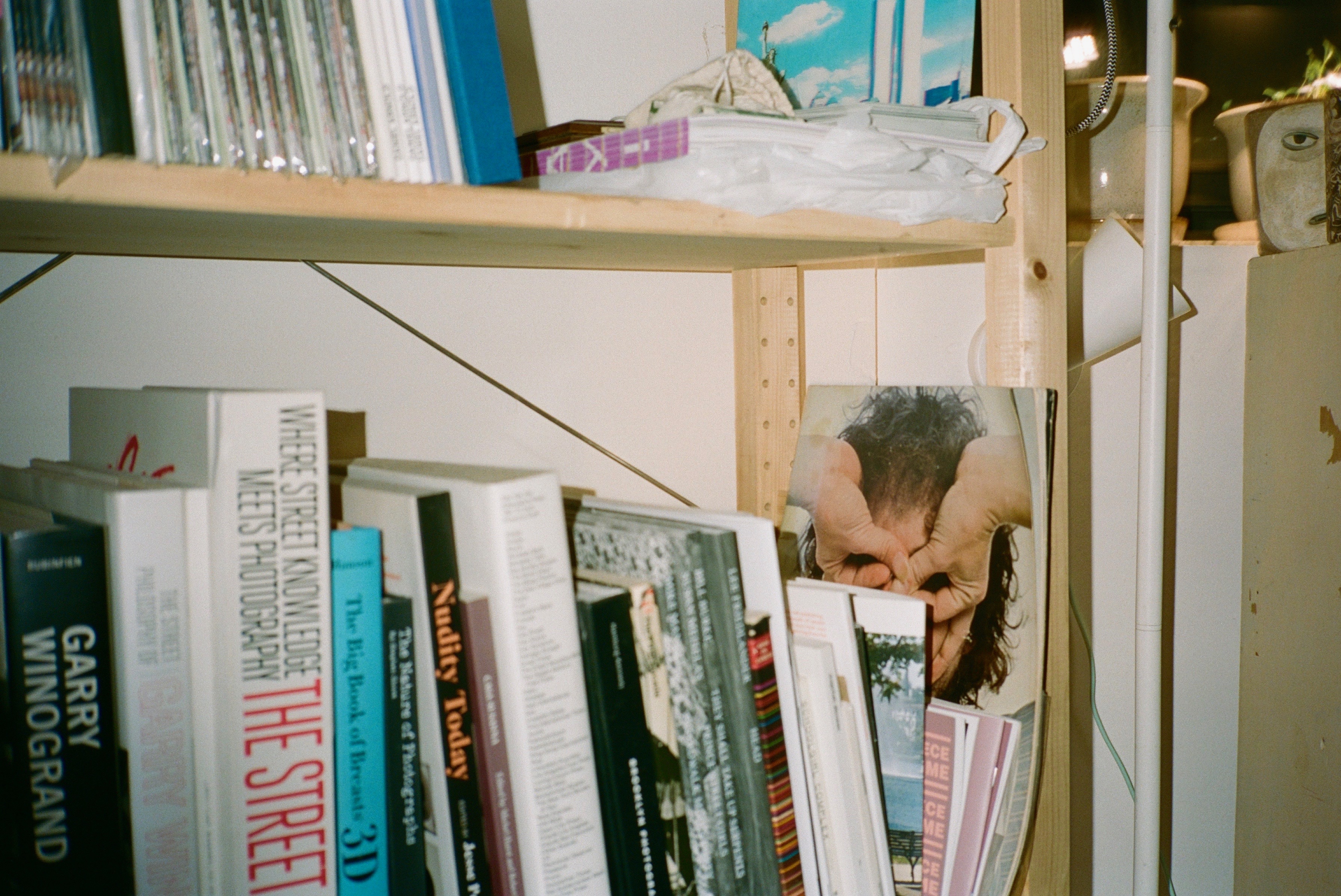 Bookshelf in apartment by Erin Clifford