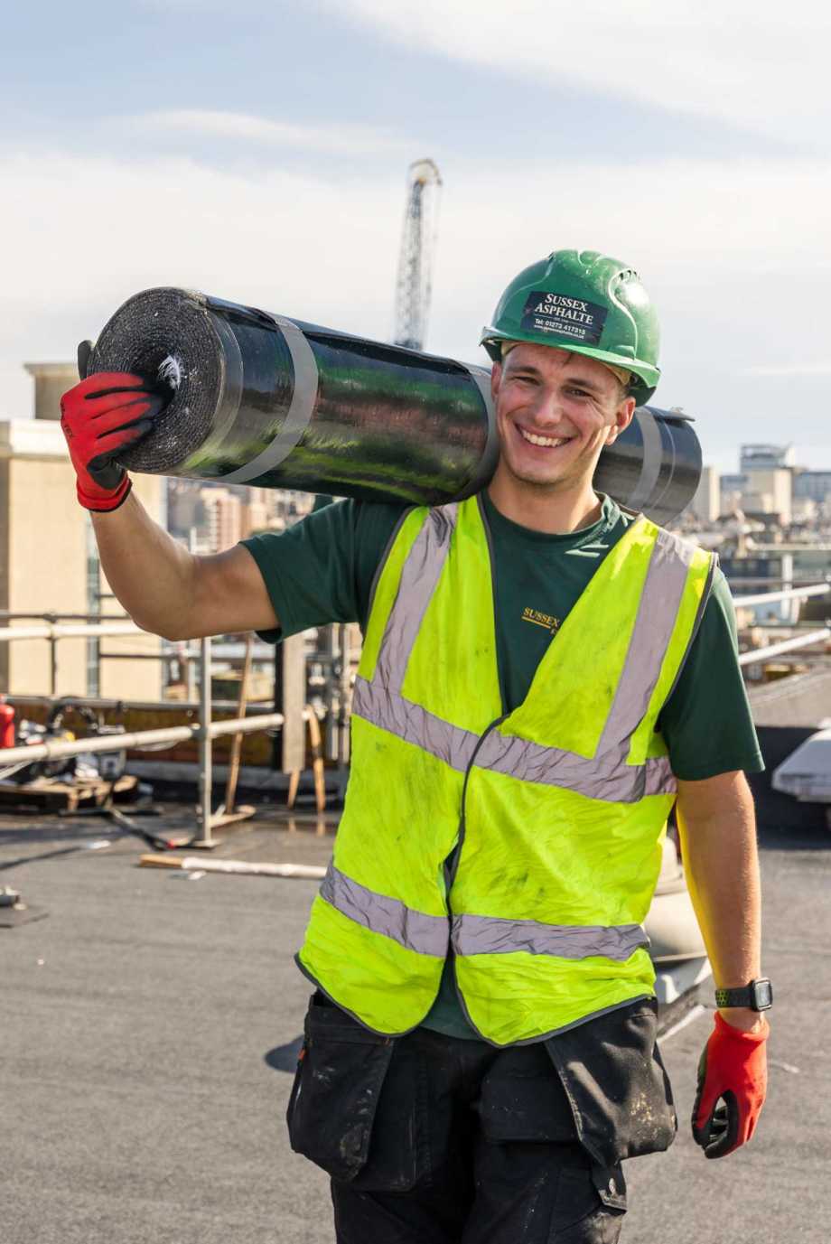 Charlie Plant, winner of BMI Apprentice of the Year 2023 in Flat Roofing, on the roof with Asphalt Roofing