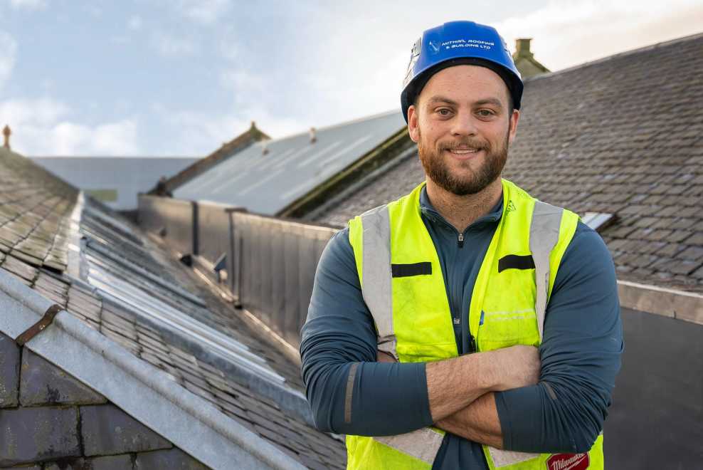 Euan Forsyth, from Mithril Roofing, winner of BMI Redland Apprentice of the Year 2023, at work on the roof