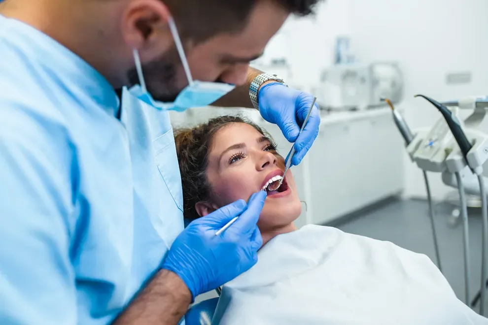 woman-getting-teeth-examined