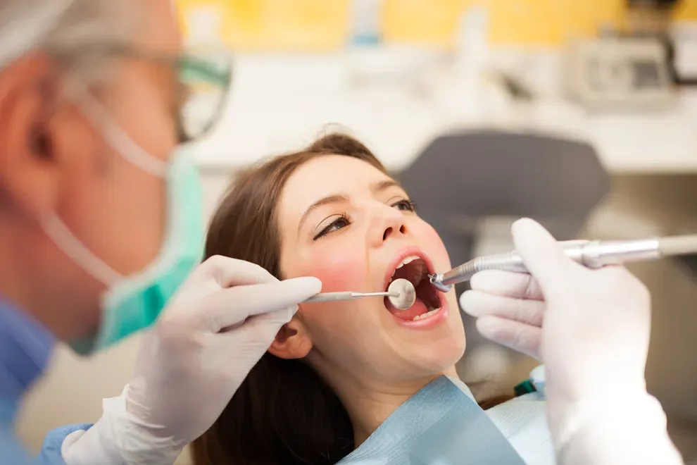 girl-in-dentists-chair-mouth-open